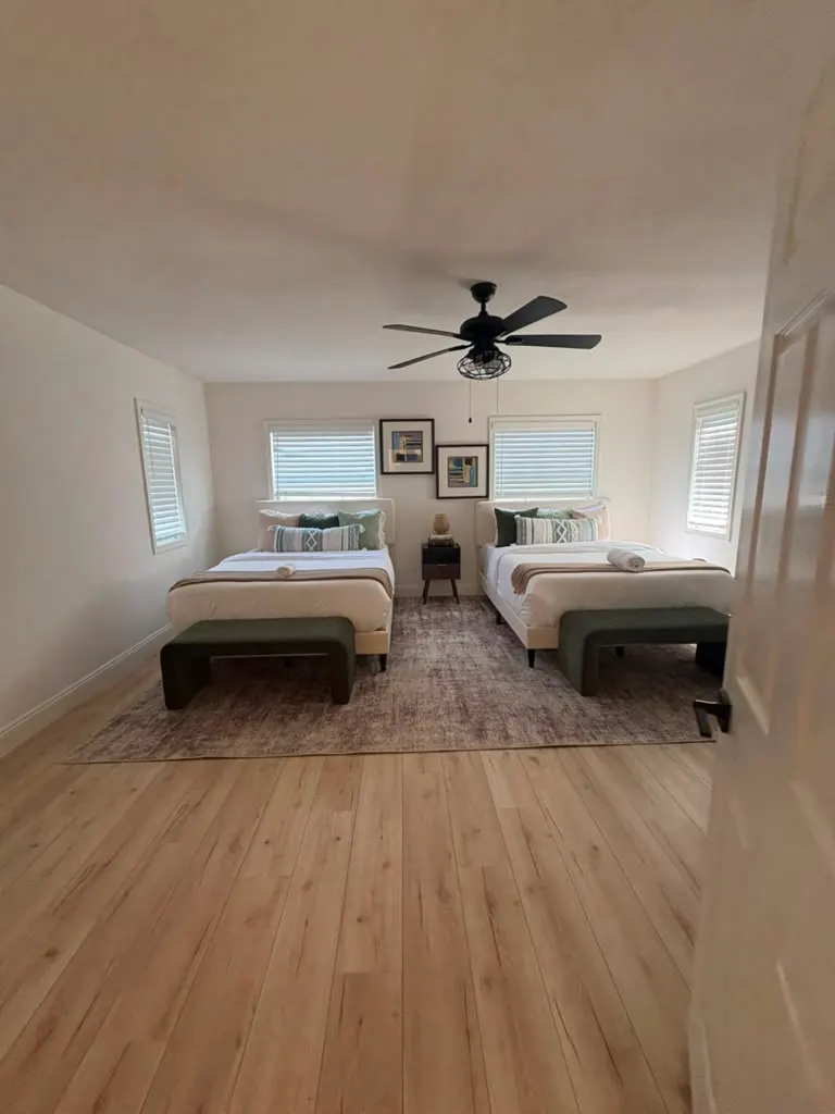 Clean empty-style bedroom with wood floors ready for a move in or move out